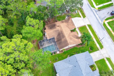 GORGEOUS 3 BEDROOM - 2 BATH - 2 CAR GARAGE POOL HOME AT THE on Tarpon Woods Golf Club in Florida - for sale on GolfHomes.com, golf home, golf lot