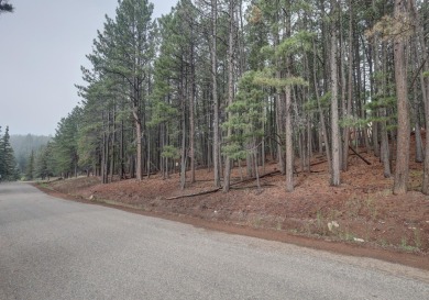 Discover your dream homesite with this beautiful 1/2 acre treed on Angel Fire Resort Country Club in New Mexico - for sale on GolfHomes.com, golf home, golf lot