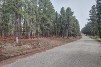 Discover your dream homesite with this beautiful 1/2 acre treed on Angel Fire Resort Country Club in New Mexico - for sale on GolfHomes.com, golf home, golf lot