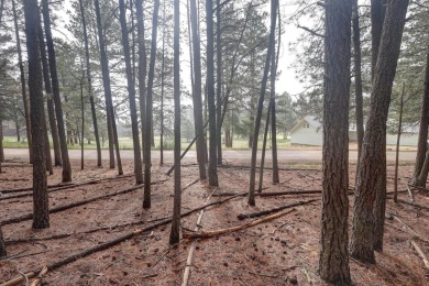 Discover your dream homesite with this beautiful 1/2 acre treed on Angel Fire Resort Country Club in New Mexico - for sale on GolfHomes.com, golf home, golf lot