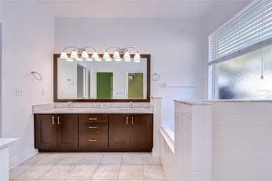 This immaculate, move-in-ready Arvida Laurel model is located on on River Hills Country Club in Florida - for sale on GolfHomes.com, golf home, golf lot