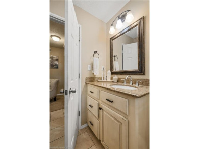 Welcome to this stunning tri-level home featuring four spacious on Vache-Grasse Country Club in Arkansas - for sale on GolfHomes.com, golf home, golf lot