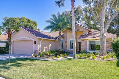 This immaculate, move-in-ready Arvida Laurel model is located on on River Hills Country Club in Florida - for sale on GolfHomes.com, golf home, golf lot