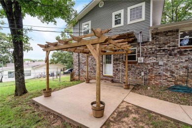 Welcome to this stunning tri-level home featuring four spacious on Vache-Grasse Country Club in Arkansas - for sale on GolfHomes.com, golf home, golf lot
