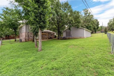 Welcome to this stunning tri-level home featuring four spacious on Vache-Grasse Country Club in Arkansas - for sale on GolfHomes.com, golf home, golf lot