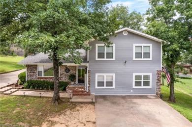 Welcome to this stunning tri-level home featuring four spacious on Vache-Grasse Country Club in Arkansas - for sale on GolfHomes.com, golf home, golf lot