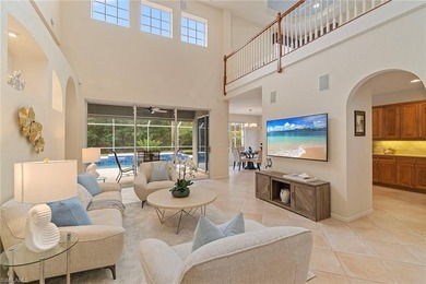 Sun-drenched southern exposure, a stunning updated pool, and on Shadow Wood Country Club in Florida - for sale on GolfHomes.com, golf home, golf lot