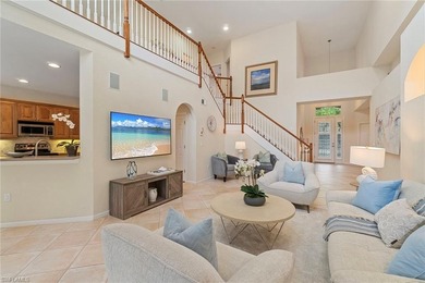 Sun-drenched southern exposure, a stunning updated pool, and on Shadow Wood Country Club in Florida - for sale on GolfHomes.com, golf home, golf lot