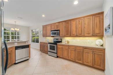 Sun-drenched southern exposure, a stunning updated pool, and on Shadow Wood Country Club in Florida - for sale on GolfHomes.com, golf home, golf lot