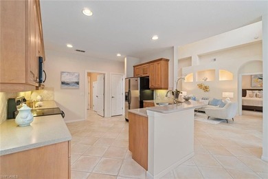 Sun-drenched southern exposure, a stunning updated pool, and on Shadow Wood Country Club in Florida - for sale on GolfHomes.com, golf home, golf lot