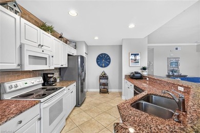 Tastefully updated first floor coach home is now available in on Pelican Sound Golf and River Club in Florida - for sale on GolfHomes.com, golf home, golf lot