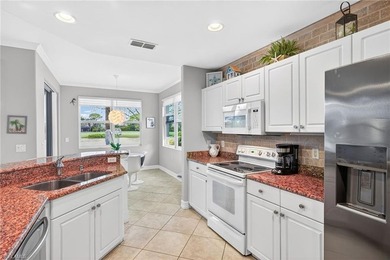 Tastefully updated first floor coach home is now available in on Pelican Sound Golf and River Club in Florida - for sale on GolfHomes.com, golf home, golf lot