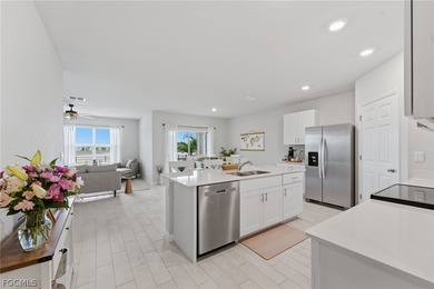 Perfectly positioned to capture tranquil LAKE and FOUNTAIN VIEWS on Herons Glen Golf and Country Club in Florida - for sale on GolfHomes.com, golf home, golf lot