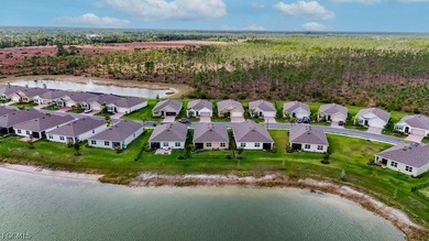 Perfectly positioned to capture tranquil LAKE and FOUNTAIN VIEWS on Herons Glen Golf and Country Club in Florida - for sale on GolfHomes.com, golf home, golf lot