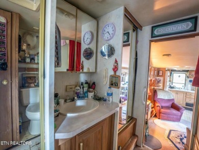 This charming property offers a newer washer and dryer, a on Lake Tansi Village Country Club in Tennessee - for sale on GolfHomes.com, golf home, golf lot