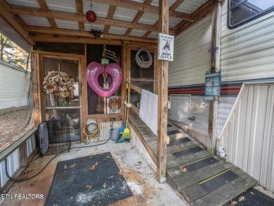 This charming property offers a newer washer and dryer, a on Lake Tansi Village Country Club in Tennessee - for sale on GolfHomes.com, golf home, golf lot