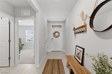 Perfectly positioned to capture tranquil LAKE and FOUNTAIN VIEWS on Herons Glen Golf and Country Club in Florida - for sale on GolfHomes.com, golf home, golf lot