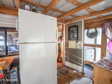 This charming property offers a newer washer and dryer, a on Lake Tansi Village Country Club in Tennessee - for sale on GolfHomes.com, golf home, golf lot