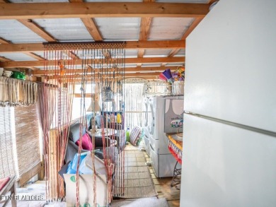 This charming property offers a newer washer and dryer, a on Lake Tansi Village Country Club in Tennessee - for sale on GolfHomes.com, golf home, golf lot