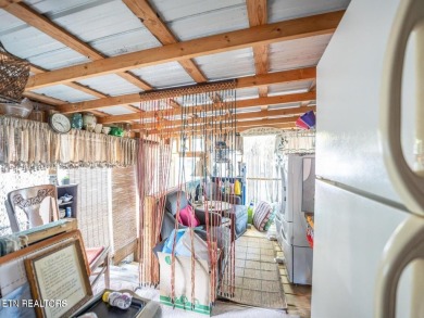 This charming property offers a newer washer and dryer, a on Lake Tansi Village Country Club in Tennessee - for sale on GolfHomes.com, golf home, golf lot