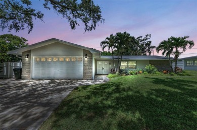 Welcome to this stunning renovated 4-bedroom, 3-bathroom pool on The Dunedin Country Club in Florida - for sale on GolfHomes.com, golf home, golf lot