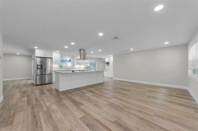 Welcome to this stunning renovated 4-bedroom, 3-bathroom pool on The Dunedin Country Club in Florida - for sale on GolfHomes.com, golf home, golf lot