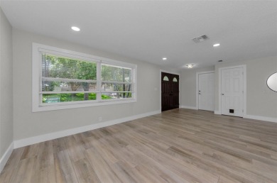 Welcome to this stunning renovated 4-bedroom, 3-bathroom pool on The Dunedin Country Club in Florida - for sale on GolfHomes.com, golf home, golf lot