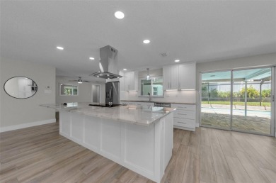 Welcome to this stunning renovated 4-bedroom, 3-bathroom pool on The Dunedin Country Club in Florida - for sale on GolfHomes.com, golf home, golf lot