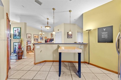 This beautiful 2-bedroom, 2-bath townhome features vaulted on Woodmont Country Club in Florida - for sale on GolfHomes.com, golf home, golf lot