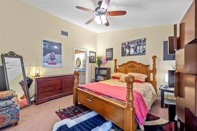 This beautiful 2-bedroom, 2-bath townhome features vaulted on Woodmont Country Club in Florida - for sale on GolfHomes.com, golf home, golf lot