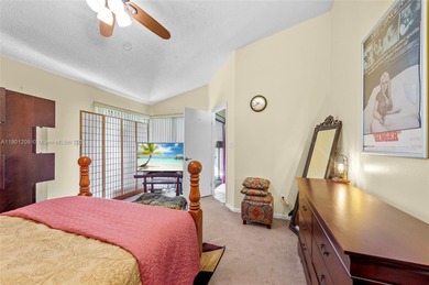 This beautiful 2-bedroom, 2-bath townhome features vaulted on Woodmont Country Club in Florida - for sale on GolfHomes.com, golf home, golf lot