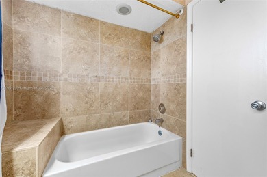 This beautiful 2-bedroom, 2-bath townhome features vaulted on Woodmont Country Club in Florida - for sale on GolfHomes.com, golf home, golf lot