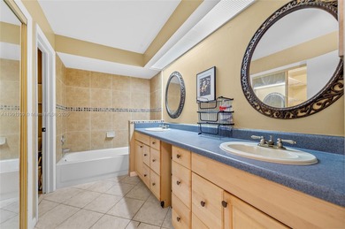 This beautiful 2-bedroom, 2-bath townhome features vaulted on Woodmont Country Club in Florida - for sale on GolfHomes.com, golf home, golf lot