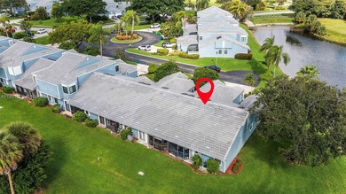 This beautiful 2-bedroom, 2-bath townhome features vaulted on Woodmont Country Club in Florida - for sale on GolfHomes.com, golf home, golf lot