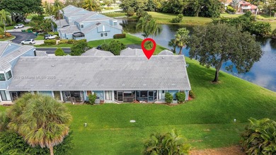 This beautiful 2-bedroom, 2-bath townhome features vaulted on Woodmont Country Club in Florida - for sale on GolfHomes.com, golf home, golf lot