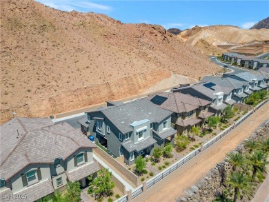 Nestled within a picturesque embrace of a serene lake and golf on Reflection Bay Golf Club in Nevada - for sale on GolfHomes.com, golf home, golf lot