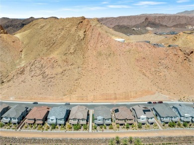 Nestled within a picturesque embrace of a serene lake and golf on Reflection Bay Golf Club in Nevada - for sale on GolfHomes.com, golf home, golf lot