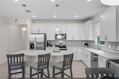 Why wait to build when you can have nearly new? This light and on River Hall Country Club in Florida - for sale on GolfHomes.com, golf home, golf lot