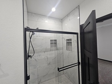 Brand new construction. Located in Hidden Bridge Ranch across on Hidden Bridge Golf Club in Wyoming - for sale on GolfHomes.com, golf home, golf lot