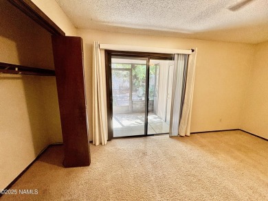 Discover a peaceful single-level home steps away from the golf on Aspen Valley Golf Club in Arizona - for sale on GolfHomes.com, golf home, golf lot