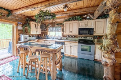 Experience the charm of rustic elegance at 590 Walnut Drive on Star Valley RV Golf Course in Wyoming - for sale on GolfHomes.com, golf home, golf lot