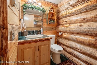 Experience the charm of rustic elegance at 590 Walnut Drive on Star Valley RV Golf Course in Wyoming - for sale on GolfHomes.com, golf home, golf lot