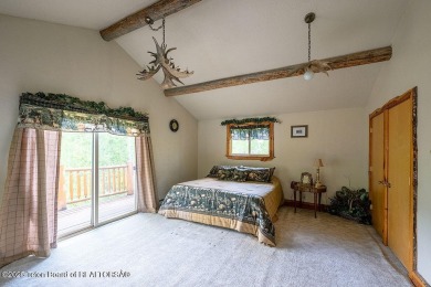 Experience the charm of rustic elegance at 590 Walnut Drive on Star Valley RV Golf Course in Wyoming - for sale on GolfHomes.com, golf home, golf lot