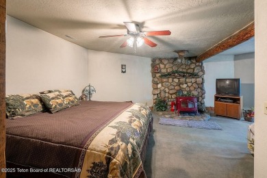 Experience the charm of rustic elegance at 590 Walnut Drive on Star Valley RV Golf Course in Wyoming - for sale on GolfHomes.com, golf home, golf lot