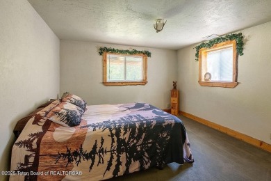 Experience the charm of rustic elegance at 590 Walnut Drive on Star Valley RV Golf Course in Wyoming - for sale on GolfHomes.com, golf home, golf lot