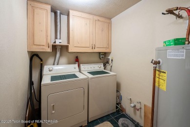 Experience the charm of rustic elegance at 590 Walnut Drive on Star Valley RV Golf Course in Wyoming - for sale on GolfHomes.com, golf home, golf lot
