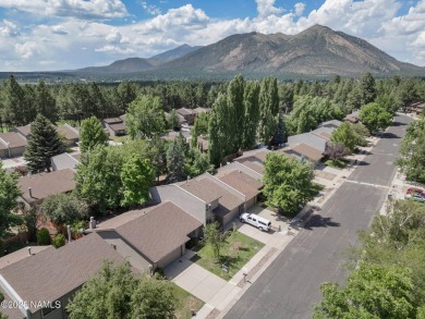 Discover a peaceful single-level home steps away from the golf on Aspen Valley Golf Club in Arizona - for sale on GolfHomes.com, golf home, golf lot