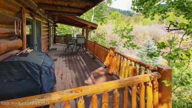 Experience the charm of rustic elegance at 590 Walnut Drive on Star Valley RV Golf Course in Wyoming - for sale on GolfHomes.com, golf home, golf lot