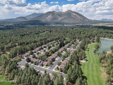 Discover a peaceful single-level home steps away from the golf on Aspen Valley Golf Club in Arizona - for sale on GolfHomes.com, golf home, golf lot