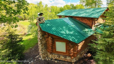 Experience the charm of rustic elegance at 590 Walnut Drive on Star Valley RV Golf Course in Wyoming - for sale on GolfHomes.com, golf home, golf lot